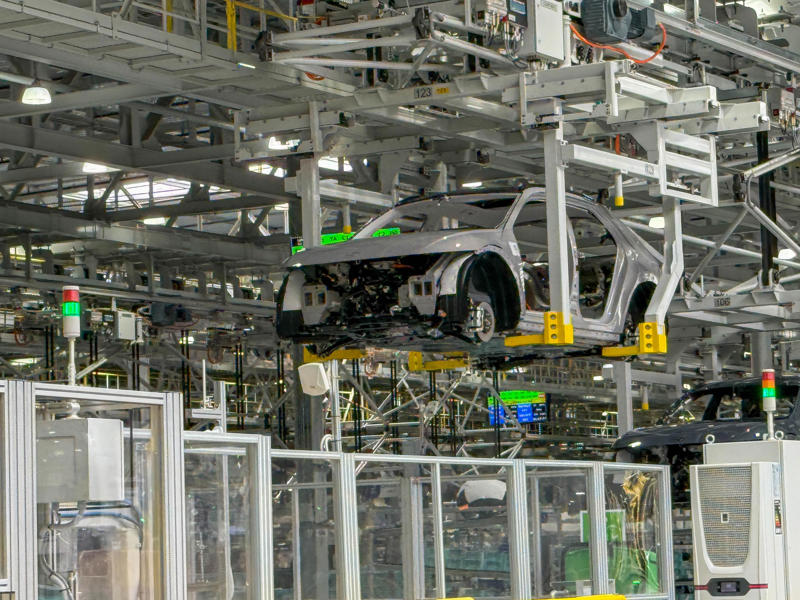 Here, the painted bodies are married with their battery packs and skateboard chassis. My tour began in the plant's modern main lobby., The Metaplant site consists of 11 buildings totalling 7.5 million square feet of space., Stamped parts are transported by automated guided vehicles, or AGVs., The stamped metal panels are then stored in these massive racks., Here are parts of the Ioniq 9, Hyundai's new flagship three-row EV SUV., The next part of the tour is the welding shop., The vehicles' interiors are then assembled by hand.