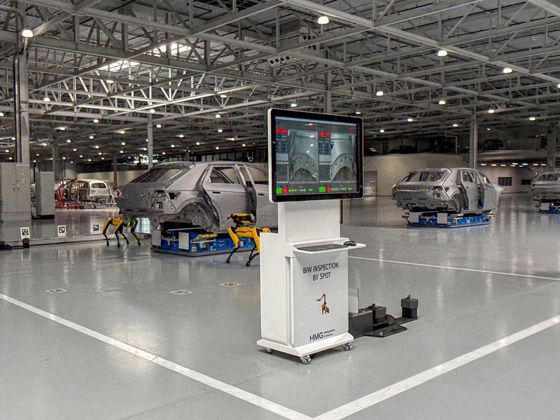 In addition to human eyes, the vehicles are also inspected by a pair of Boston Dynamics robot dogs called Spot. My tour began in the plant's modern main lobby., The Metaplant site consists of 11 buildings totalling 7.5 million square feet of space., Stamped parts are transported by automated guided vehicles, or AGVs., The stamped metal panels are then stored in these massive racks., Here are parts of the Ioniq 9, Hyundai's new flagship three-row EV SUV., The next part of the tour is the welding shop., The vehicles' interiors are then assembled by hand.