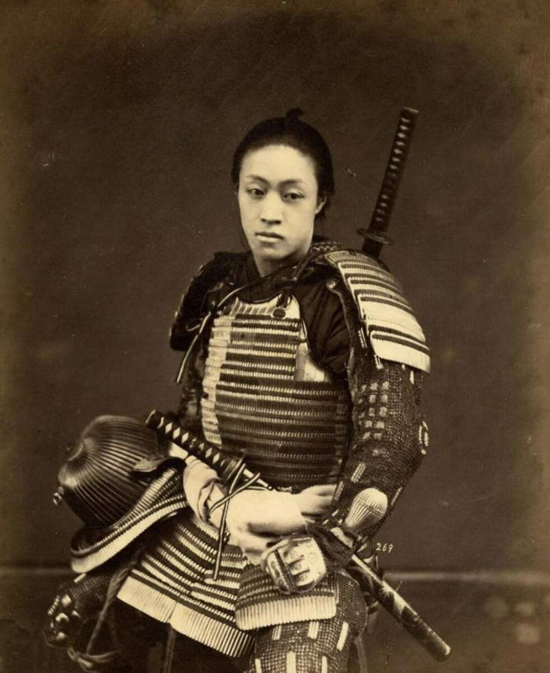 6. A portrait of a man wearing samurai armor back in the 1870s 1. A solid pose indeed, 2. Paris in the Belle Époque (ca. 1870-1890), 3. The legend goes that this was taken back in Pennsylvania, 4. Someone's great grandmother captured in a tender moment way back in the day, 5. Seems like he might be a great dad, 6. A portrait of a man wearing samurai armor back in the 1870s, 7. A couple young and in love all the way back in the 1870s, 8. Taken back in Norway in the 1870s, 9. A good day to you as well my good sir, 10. Gettysburg in 1870, 11. Taken in Norwich, England in the 1870s, 12. A portrait of Emil Bessels in the 1870s, 13. The penny farthing bikes were the bikes to ride around in during the 1870s, 14. Looks to be a joyous gathering indeed, 15. Now that's a fancy 1870s gentleman if I've ever seen one, 16. This looks to be a tumultuous alleyway to navigate back in the 1870s, 17. A stunning, captivating shot indeed, 18. Honestly, the guy is giving off some kind of vibe with the big beard, 19. She seems like she didn't have the best morning she's ever had
