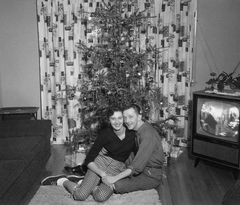 24. First Christmas Together, 1957 1. 22-Year-Old Being Dropped Off for Naval Flight Training in South Texas, 2. NASA Scientists With Their Board of Calculations, 3. Queen Elizabeth II Driving Prince Charles and Princess Anne, 4. Kids on a Movie Date, 5. Audrey Hepburn Casually Grocery Shopping With Her Pet Deer, 6. A Mother With Her First 11 Kids — She Went on to Have Six More, 7. The Runner-Up in a Shirley Temple Look-Alike Contest, 8. Macy’s Thanksgiving Day Parade, 9. Sightseers at Niagara Falls, 10. The First African-American Stewardess in the U.S., Ruth Carol Taylor, 11. Open Air School in the Netherlands, 12. The Original TV Remote, 13. Mingling With Bears at Yellowstone, 14. Roadside Meals While Traveling, 15. Listening to Music at a Record Store, 16. Getting Cooled Air Piped Into the Car While Eating at a Drive-in Restaurant, 17. Selfie: 1957 Style, 18. Teenage Beatles Members Performing as Wedding Singers, 19. Bride and Groom, 20. Danish Zookeeper Watering the Emperor Penguins, 21. A Couple’s First Christmas Together, 22. Daytona Beach, 23. Joe Pesci at 14 Years Old, 24. Woman in One of Nine Stores She Opened, 25. Family Pool Day, 26. Elizabeth Eckford, One of the Nine Black Students Who Integrated Into Little Rock’s Central High School, 27. Oh, You Know, Just a Llama in Times Square, 28. Jayne Mansfield With Miss Hollywood, 29. Illegal Drag Racing in the L.A. River Basin