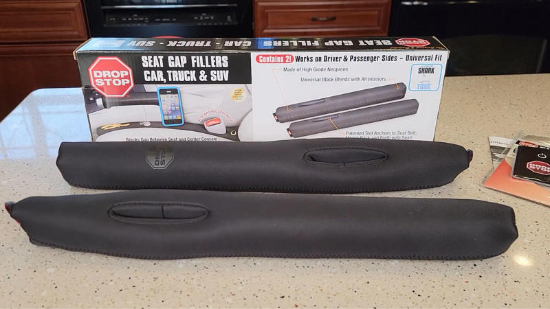 1. Phone Mount That Holds, 2. LED Bulbs For Headlights, 3. Padded Armrest Cover, 4. Cabin Air Filter Replacement, 5. Blind Spot Mirrors, 6. Seat Gap Filler Pads, 7. Rubber Floor Mats, 8. Steering Wheel Cover That Grips, 9. Bluetooth FM Transmitter, 10. Valve Stem Caps With Pressure Indicators, 11. Magnetic Sunshade For Windshield, 12. Quick-Charge USB Adapter, 13. Hydrophobic Wiper Blades, 14. Rear Seat Hook Attachments, 15. Hood Struts That Actually Work, 16. Trunk Organizer With Compartments, 17. Key Fob Shell Replacement, 18. Portable Jump Starter, 19. Door Edge Guards, 20. Interior LED Light Swap