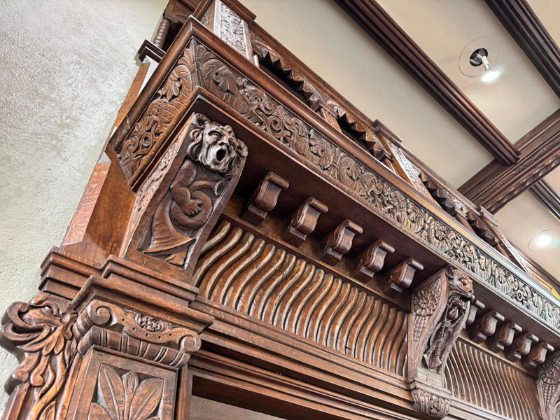 There are personalized touches all over the house's limestone exterior., It took three years to complete Coe Hall., One of the first rooms you can view is Coe's den., It's covered in dark wood, giving a masculine atmosphere., The art in the living room is original to the home., It's certainly not a bad place to spend your weekends., The craftsmanship throughout the house was impossible to miss., There was another portrait of Coe hanging in the corner., The main staircase felt straight out of a castle., And no, that's not wallpaper. This design was hand-painted onto the wall., The windows gave her a view of the gardens she painstakingly designed., This is her bathroom. Once again, it's very French., Now it was time to check out the much-revered grounds., Right off the bat, this fountain caught my eye., Can't you just hear someone saying, "Once upon a time…"?, Rogers entertained her friends in the Tea House on nice days., It looks like the inside of a Tiffany's box., Walking through it felt like walking through a storybook., One corner of the building was anchored by this giant palm tree., It has the largest collection of camellias under glass in the northeast., However, camellia season is in January, so we missed it.