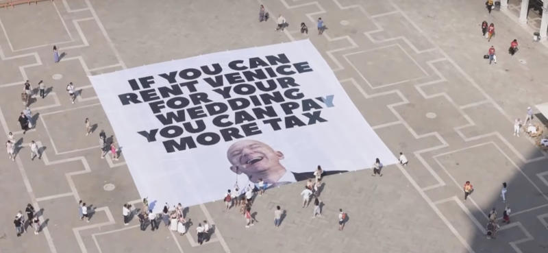 Greater tax justice Jeff Bezos' wedding sparks protests in Venice, A part of the city privatized for the ceremony, Celebrities parade along the canals of Venice, The "No Space for Bezos" collective, Yachts facing working-class neighborhoods, Greater tax justice, "The richest 1% are ruining the world.", A Jeff Bezos mannequin floats on the Grand Canal, Bezos forced to change the location of his ball, Donations to UNESCO as wedding gifts, Work for a hundred people, according to Il Foglio, Three million euros donated for the lagoon