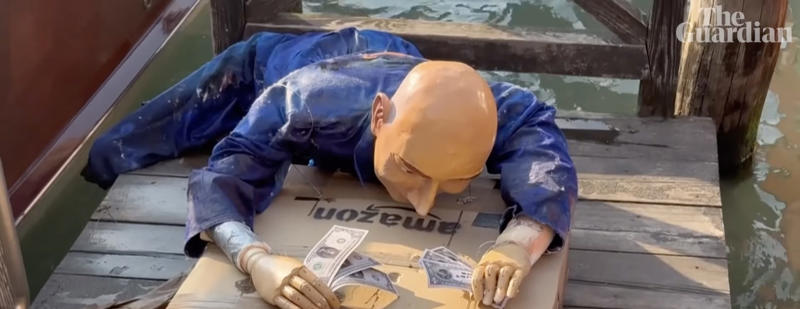 A Jeff Bezos mannequin floats on the Grand Canal Jeff Bezos' wedding sparks protests in Venice, A part of the city privatized for the ceremony, Celebrities parade along the canals of Venice, The "No Space for Bezos" collective, Yachts facing working-class neighborhoods, Greater tax justice, "The richest 1% are ruining the world.", A Jeff Bezos mannequin floats on the Grand Canal, Bezos forced to change the location of his ball, Donations to UNESCO as wedding gifts, Work for a hundred people, according to Il Foglio, Three million euros donated for the lagoon