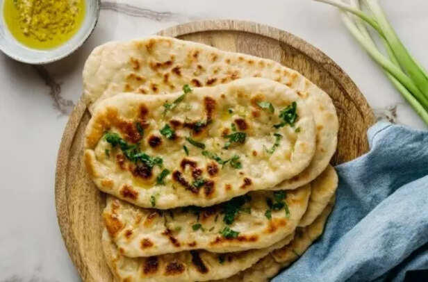 1. Samosa: The Persian Traveler, 2. Naan: Born in the Imperial Ovens, 3. Vindaloo: A Portuguese Party, 4. Chicken Tikka Masala: Born in Britain, 5. Biryani: Tracing Back to Persia, 6. Mulligatawny Soup: A Colonial Invention, 7. Chai: China’s Gift, India’s Obsession, 8. Gulab Jamun: A Persian Sweet Treat, 9. Falooda: From Iran With Love, 10. Jalebi: A Middle Eastern Spiral