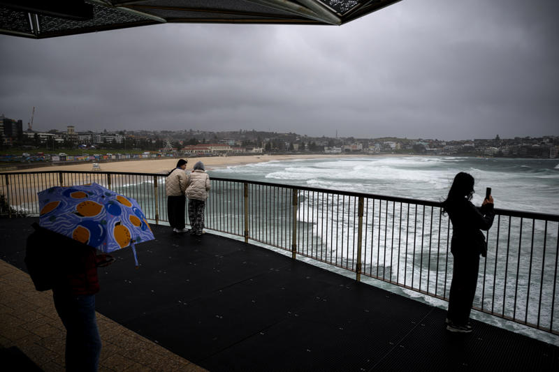 Key Points, Power to most houses to be restored tonight, energy company says, Mapped: Flood watches and warnings today, Entire NSW coastline under coastal hazard warning as dangerous surf continues, Photos: Waterlogging and fallen trees after heavy rain and winds batter NSW, SES responds to thousands of incidents as flash flooding threat grows, Repeated flooding likely to worsen, experts warn, Victoria border communities on watch as storm threatens to shift south, Travel chaos continues as 55 domestic flights cancelled, Low pressure system seen off the coast of NSW, Flood warnings issued for parts of Sydney, Power restored to 30,000 customers, thousands still in the dark, Authorities warn of higher number of emergency calls, What is a ‘bomb cyclone’?, More than 29,000 homes still without power, Severe weather to persist on Wednesday, forecasters say, 140 Sydney flights cancelled amid wild weather; travel insurance warning issued, Which direction is the coastal low heading?, Watch: Coastal residents told to 'evacuate now', Single runway operation begins at Sydney airport, Weather system expected to shift offshore on Wednesday, Qantas cancels arrival celebrations in Sydney for longest commercial flight, Climate change and warm oceans may be fuelling storm intensity, Summary: Here's what you need to know about the storm hitting Australia, Emergency services deployed as storm damage mounts, Over 20 road closures as storm wreaks havoc on NSW transport, Full story: Australia flights cancelled as bomb cyclone hits New South Wales, Power outages climb to 30,000 as storm batters NSW, Video: Wind gusts and large swells in Sydney, Ferries and trains suspended as storm causes major transport chaos in NSW, Mapped: Areas under rainfall and wind warning, Fallen trees spark car crashes on NSW coast, Tens of thousands without power as storm lashes NSW coast, Photos: Large swells seen at beaches, Severe weather to persist tomorrow, easing by Friday, forecasters say, Flights cancelled as storm disrupts Sydney Airport, 'Sheer size' of system is 'enormous', minister says, Emergency evacuations underway on Central Coast as storm batters coastline, 'Stay indoors’ warning as bomb cyclone pummels Australia’s east coast, Sydney Airport down to single runway as winds batter flights