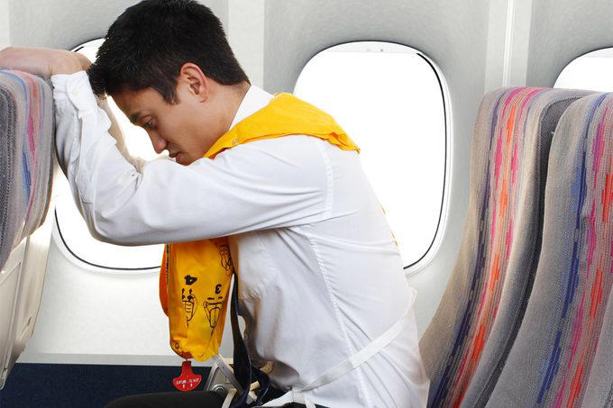 Pay attention to the safety demonstration, Consider booking a middle seat—maybe, Opt for the back of the plane or an exit row, Dress appropriately, Wear the right type of shoes, Bring a car seat for young children, Follow directions, Brace for impact, Protect yourself from the smoke, Leave your bag, and grab supplies, if possible, Move away from the plane, About the experts, Why trust us, Sources: