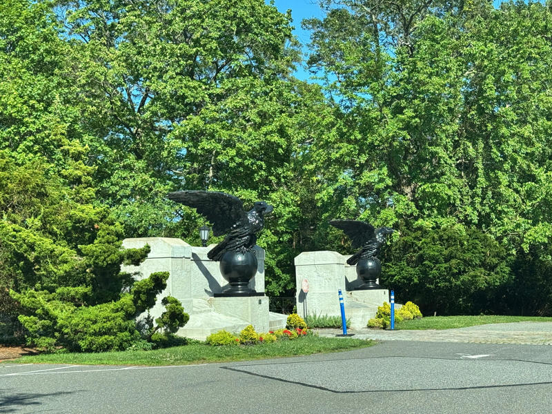 At the entrance stood a pair of stone eagles, which were taken from Grand Central Terminal. Cornelius Vanderbilt himself commissioned the train station. Inside the grounds are hiking trails, gardens, and a gift shop., Before I toured the home, I visited the museum grounds., But the landscaping was still immaculate., Then it was time to head over to Eagle's Nest., One side of the mansion is a natural history museum., The first room I saw was the dining room., The ceiling is constructed from Florida cedar, or Southern Red cedar., This is her changing room and bathroom., The house was set on a hill, so the yard was multi-level., First, I walked to the right., There was a large reflecting pool., But the main attraction was, once again, the view., To my surprise, it was a filled-in saltwater pool., They'd even left the ladder in., There were also changing rooms.
