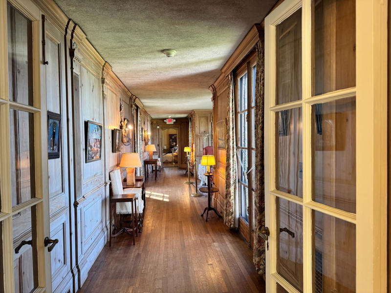 To get to his wife's quarters, I had to pass through the breakfast room. Inside the grounds are hiking trails, gardens, and a gift shop., Before I toured the home, I visited the museum grounds., But the landscaping was still immaculate., Then it was time to head over to Eagle's Nest., One side of the mansion is a natural history museum., The first room I saw was the dining room., The ceiling is constructed from Florida cedar, or Southern Red cedar., This is her changing room and bathroom., The house was set on a hill, so the yard was multi-level., First, I walked to the right., There was a large reflecting pool., But the main attraction was, once again, the view., To my surprise, it was a filled-in saltwater pool., They'd even left the ladder in., There were also changing rooms.