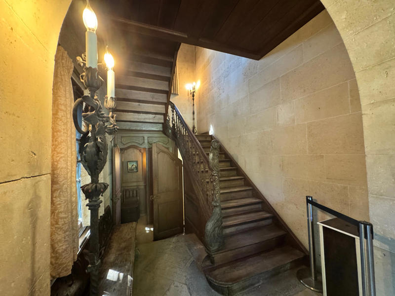 Upon entering the home, the first thing you see is the staircase. It was imported from a Belgian castle. Inside the grounds are hiking trails, gardens, and a gift shop., Before I toured the home, I visited the museum grounds., But the landscaping was still immaculate., Then it was time to head over to Eagle's Nest., One side of the mansion is a natural history museum., The first room I saw was the dining room., The ceiling is constructed from Florida cedar, or Southern Red cedar., This is her changing room and bathroom., The house was set on a hill, so the yard was multi-level., First, I walked to the right., There was a large reflecting pool., But the main attraction was, once again, the view., To my surprise, it was a filled-in saltwater pool., They'd even left the ladder in., There were also changing rooms.