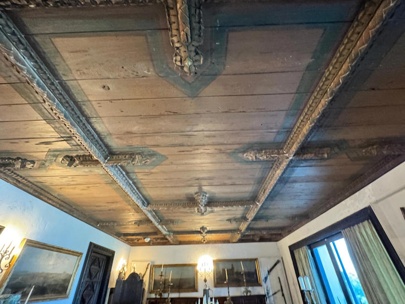 The ceiling is constructed from Florida cedar, or Southern Red cedar. Inside the grounds are hiking trails, gardens, and a gift shop., Before I toured the home, I visited the museum grounds., But the landscaping was still immaculate., Then it was time to head over to Eagle's Nest., One side of the mansion is a natural history museum., The first room I saw was the dining room., The ceiling is constructed from Florida cedar, or Southern Red cedar., This is her changing room and bathroom., The house was set on a hill, so the yard was multi-level., First, I walked to the right., There was a large reflecting pool., But the main attraction was, once again, the view., To my surprise, it was a filled-in saltwater pool., They'd even left the ladder in., There were also changing rooms.