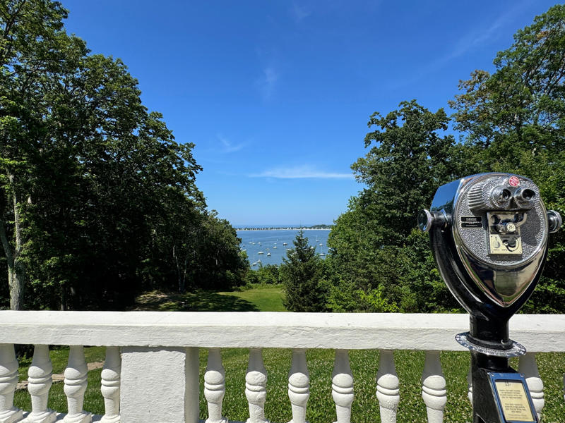 Even if the roses were already gone, the views of the Long Island Sound were worth it. Inside the grounds are hiking trails, gardens, and a gift shop., Before I toured the home, I visited the museum grounds., But the landscaping was still immaculate., Then it was time to head over to Eagle's Nest., One side of the mansion is a natural history museum., The first room I saw was the dining room., The ceiling is constructed from Florida cedar, or Southern Red cedar., This is her changing room and bathroom., The house was set on a hill, so the yard was multi-level., First, I walked to the right., There was a large reflecting pool., But the main attraction was, once again, the view., To my surprise, it was a filled-in saltwater pool., They'd even left the ladder in., There were also changing rooms.