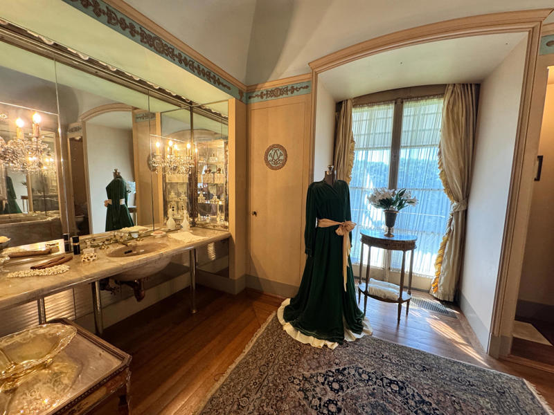 This is her changing room and bathroom. Inside the grounds are hiking trails, gardens, and a gift shop., Before I toured the home, I visited the museum grounds., But the landscaping was still immaculate., Then it was time to head over to Eagle's Nest., One side of the mansion is a natural history museum., The first room I saw was the dining room., The ceiling is constructed from Florida cedar, or Southern Red cedar., This is her changing room and bathroom., The house was set on a hill, so the yard was multi-level., First, I walked to the right., There was a large reflecting pool., But the main attraction was, once again, the view., To my surprise, it was a filled-in saltwater pool., They'd even left the ladder in., There were also changing rooms.