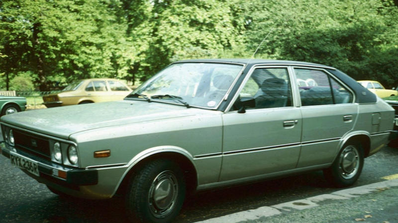 Cars That Carry A Flag, Lamborghini Miura, The Answer, Toyota 2000GT, Volkswagen Beetle, Ford GT40, Citroen DS, Datsun 240Z, Rolls-Royce Phantom, Renault 5 Turbo, Chevrolet Corvette C1, Koenigsegg Jesko, Fiat 500 (Cinquecento), Aston Martin DB5, Hyundai Pony, Tatra 87, Mazda MX-5 Miata NA, BMW M3 E30, Volvo P1800, Peugeot 205 GTI, Pontiac Firebird Trans Am, Pagani Zonda, SAAB 900 Turbo, Porsche 911 (1964)