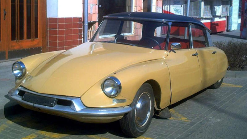 Cars That Carry A Flag, Lamborghini Miura, The Answer, Toyota 2000GT, Volkswagen Beetle, Ford GT40, Citroen DS, Datsun 240Z, Rolls-Royce Phantom, Renault 5 Turbo, Chevrolet Corvette C1, Koenigsegg Jesko, Fiat 500 (Cinquecento), Aston Martin DB5, Hyundai Pony, Tatra 87, Mazda MX-5 Miata NA, BMW M3 E30, Volvo P1800, Peugeot 205 GTI, Pontiac Firebird Trans Am, Pagani Zonda, SAAB 900 Turbo, Porsche 911 (1964)