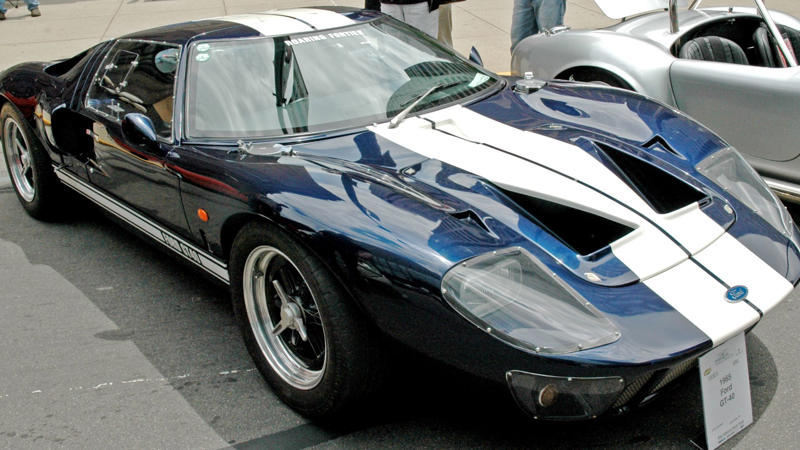 Cars That Carry A Flag, Lamborghini Miura, The Answer, Toyota 2000GT, Volkswagen Beetle, Ford GT40, Citroen DS, Datsun 240Z, Rolls-Royce Phantom, Renault 5 Turbo, Chevrolet Corvette C1, Koenigsegg Jesko, Fiat 500 (Cinquecento), Aston Martin DB5, Hyundai Pony, Tatra 87, Mazda MX-5 Miata NA, BMW M3 E30, Volvo P1800, Peugeot 205 GTI, Pontiac Firebird Trans Am, Pagani Zonda, SAAB 900 Turbo, Porsche 911 (1964)