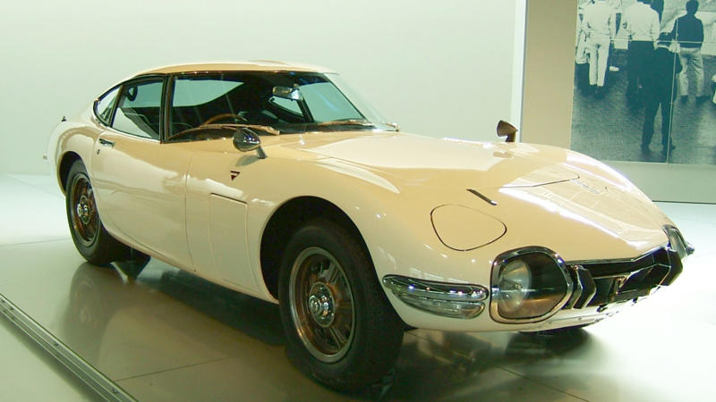Cars That Carry A Flag, Lamborghini Miura, The Answer, Toyota 2000GT, Volkswagen Beetle, Ford GT40, Citroen DS, Datsun 240Z, Rolls-Royce Phantom, Renault 5 Turbo, Chevrolet Corvette C1, Koenigsegg Jesko, Fiat 500 (Cinquecento), Aston Martin DB5, Hyundai Pony, Tatra 87, Mazda MX-5 Miata NA, BMW M3 E30, Volvo P1800, Peugeot 205 GTI, Pontiac Firebird Trans Am, Pagani Zonda, SAAB 900 Turbo, Porsche 911 (1964)