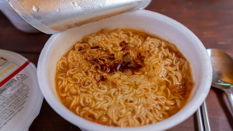 2. Instant Noodles 1. Sweetened Yogurt, 2. Instant Noodles, 3. Processed Meats, 5. Alcohol, 6. Processed Snacks, 7. Canned Fruit, 8. Canned Soup, 9. Frozen Pizza, 10. Instant Oatmeal, 11. White Bread, 12. Processed Cheese, 13. Fried Foods, 14. Sugary Breakfast Cereals, 15. Charcoaled or Barbecued Meat, 16. Processed Baked Goods, 17. Energy Drinks, 18. Bottled Salad Dressing, 19. Bottled Marinades & Sauces, 20. Sweets