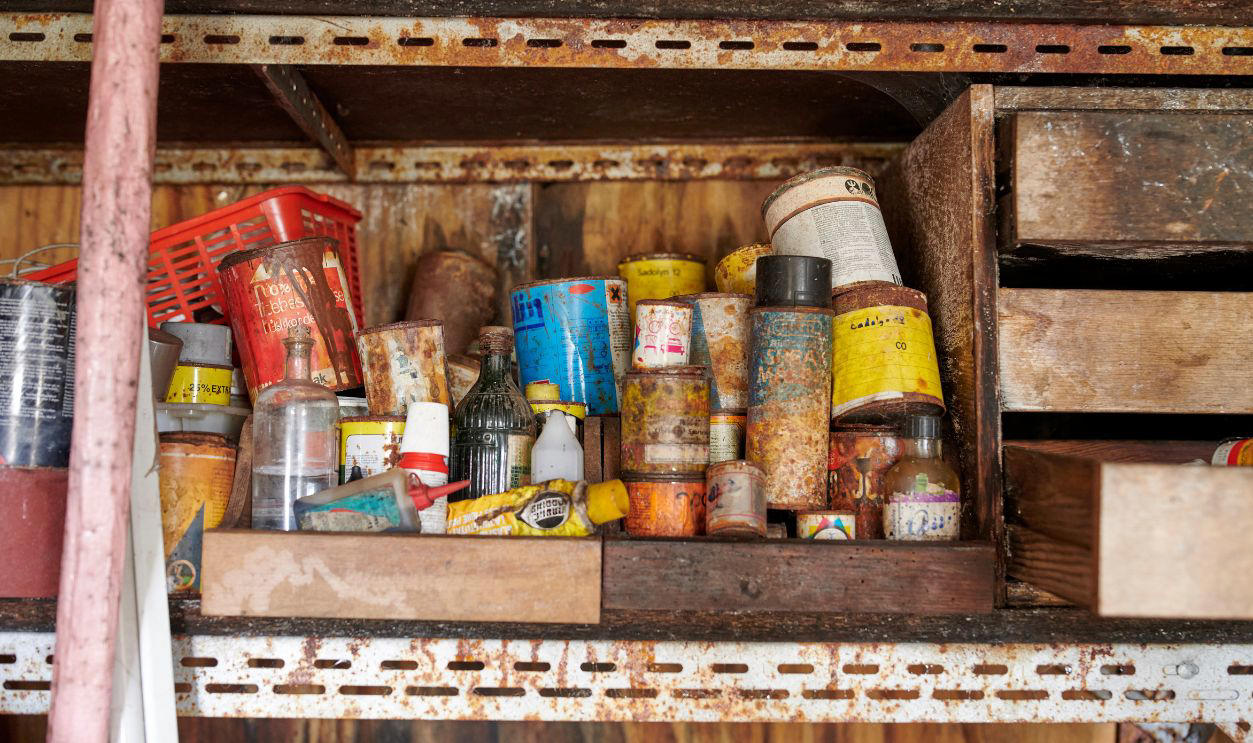 Boomer Garages Feel Like Time Capsules, Coffee Cans Full Of Screws, Old License Plates, WD-40 Spray Cans, Fishing Rods From The 1970s, Pegboard Tool Walls, Paint Cans With Dried Lids, Jumper Cables In A Knot, Glass Jars Of Bolts, Garden Gloves With Cracked Palms, National Geographic Stacks, Manual Jack And Tire Iron, Portable Work Lights, Push Reel Lawn Mower, Garage Fridge, Manual Grass Clippers, Workbench With A Vise-Grip, Christmas Lights In Grocery Bags, Spare Fan Belts, Wood Cabinets With Mystery Drawers, Old Radios, Plastic Buckets Of Hardware, Car Wax Kits, Tangled Extension Cords, Sears Folding Workbench, Mason Jars Of Random Parts