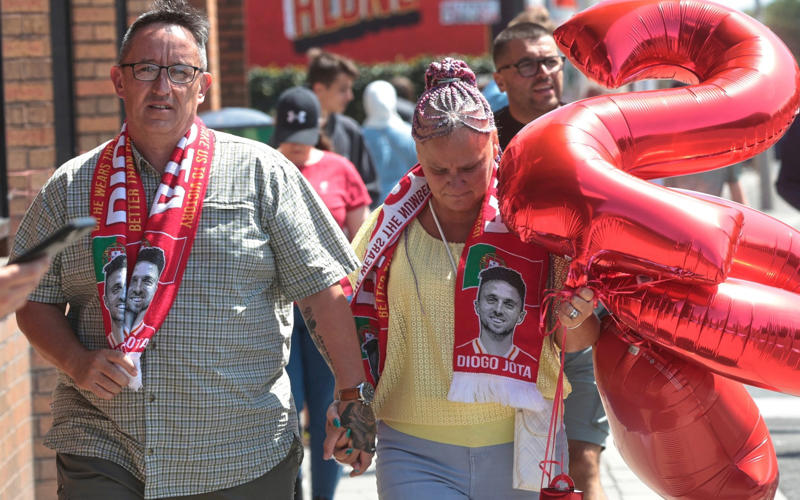 07:09 PM BST, Hughes and Edwards: ‘We feel utterly bereft’, 07:03 PM BST, Pogba posts, 06:49 PM BST, Statement from Fenway Sport Group, 06:40 PM BST, Slot: ‘The pain is so raw’, 05:55 PM BST, Bruno Fernandes posts, 04:50 PM BST, PSG pay tribute, 04:38 PM BST, Bayern do similar at training, 04:32 PM BST, Chelsea pay tribute, 04:14 PM BST, Real Madrid mark Jota’s passing, 03:44 PM BST, Messi posts on Instagram, 03:26 PM BST, More from Jota’s former team Wolves, 02:54 PM BST, Harvey Elliott pays tribute, 02:38 PM BST, Some of the messages left for Jota at Anfield, 02:31 PM BST, Dalglish: ‘Football is not important at this sad time’, 02:16 PM BST, More pictures from outside Anfield, 01:47 PM BST, The Prince and Princess of Wales pay tribute, 01:40 PM BST, More tributes flooding in, 01:37 PM BST, ‘A possible speeding incident’, 01:32 PM BST, Jota ‘will never walk alone’, 01:30 PM BST, Updates from Liverpool, 01:28 PM BST, Map showing location of crash, 01:24 PM BST, Jurgen Klopp: ‘A great friend, loving husband and father’, 01:21 PM BST, Wimbledon reacts to tragedy, 01:15 PM BST, Jamie Carragher on Jota’s death, 01:10 PM BST, Re-live Jota’s finest moments, 01:07 PM BST, Pictured: Crash site, 12:58 PM BST, Darwin Nunez: ‘There are no words of comfort’, 12:54 PM BST, What we know so far..., 12:45 PM BST, Watch: Flag raised at half mast at Anfield, 12:34 PM BST, Deputy Prime Minister visits floral tribute, 12:17 PM BST, Jota death evokes Reyes memories, 12:14 PM BST, Watch: Jota’s message to Liverpool fan, 12:05 PM BST, Watch: the last goal Jota scored for Liverpool, 12:02 PM BST, Emotional scenes at Anfield, 11:48 AM BST, Pictured: A relationship of childhood sweethearts, 11:41 AM BST, Basketball star lends voice to tributes, 11:36 AM BST, ‘Irreparable losses for Portuguese Football’, 11:30 AM BST, Statement from Prime Minister, 11:25 AM BST, Premier League clubs pay tribute, 11:20 AM BST, Ronaldo: ‘It doesn’t make sense’, 11:18 AM BST, Andre Silva with brother at Porto in 2016, 11:12 AM BST, Minute’s silence from Uefa, 11:09 AM BST, Fans already leaving tributes at Anfield, 11:04 AM BST, Pictured: Crash site, 11:01 AM BST, Former club releases statement, 10:56 AM BST, Everton and Manchester United send condolences, 10:54 AM BST, Uefa ‘deeply saddened’ by Jota’s death, 10:49 AM BST, In pictures: Jota’s wedding to childhood sweetheart, 10:47 AM BST, Jota’s ex-Wolves teammates pay tribute, 10:42 AM BST, Pictured: Jota and family celebrate Premier League title, 10:40 AM BST, Jota died ‘after Lamborghini tyre burst’, 10:28 AM BST, Liverpool FC ‘devastated’ by ‘unimaginable loss’, 10:26 AM BST, Jota married childhood sweetheart two weeks ago, 10:22 AM BST, Jota was due to report back for training, 10:16 AM BST, Carragher: ‘I am absolutely devastated’, 10:12 AM BST, Investigation ‘suggests tyre burst’