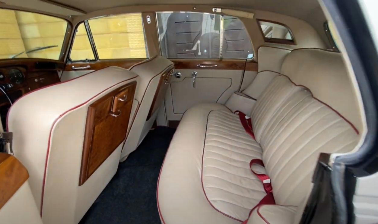 Why John Chose A Rolls-Royce, Not A Sporty Jaguar A Rock Star At His Peak And The Car That Reflected It, Why John Chose A Rolls-Royce, Not A Sporty Jaguar, Polished Black And Perfectly Conventional At First, Something Was Missing, The Psychedelic Era Was Exploding, And So Was His Imagination, From Limousine To Canvas: The Idea To Transform It, Inspired By Gypsies, Daydreams, And Eastern Designs, The Painters Behind The Paint Job, What Those Swirls And Motifs Really Meant, Londoners Were Shocked, And Some Were Furious, Art, Rebellion, Or Just Eccentricity?, Snobbery In Overdrive, The Beatles Were Changing, And So Were Their Cars, Lennon’s Rolls Becomes A Rolling Manifesto For Change, It Wasn’t Just A Showpiece, Was It Ever In The Film?, It Was Lennon’s Mobile Stage, Why He Let It Go And The Quiet Goodbye, A Gift To Canada, Its New Home, Faded Paint And Fresh Restorations Over The Years, Decades Later, It’s Still A Symbol Of Creative Defiance, Colorful Legacy