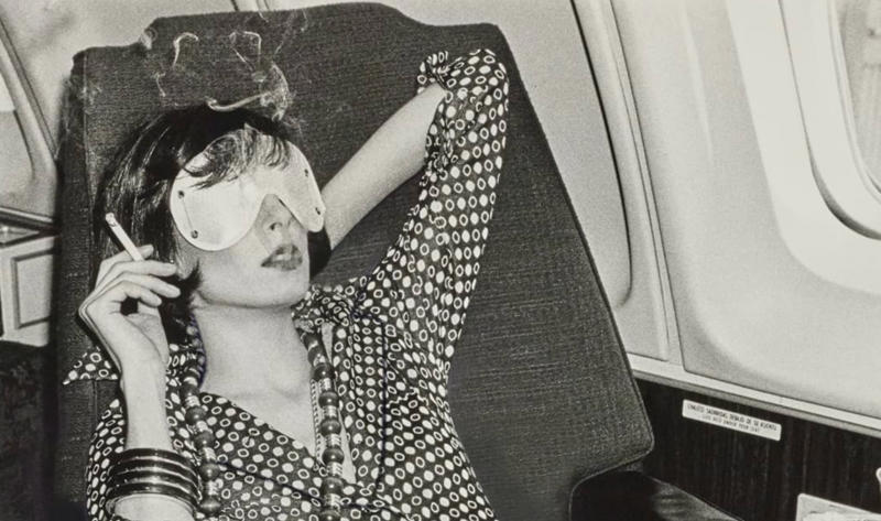 “Chilling and smoking mid-air in the 70s.” “My dad, probably 1970s. This is my favourite photo of him.”, “Pacific Southwest Airlines Stewardesses from the 70’s.”, “Economy class flying in 1970.”, “70’s Vintage Airline Stewardess.”, “Iran Air flight attendants in the 1970s.”, “First class on a United flight, 1970.”, An American Airlines advertisement from 1971., “Led Zeppelin (Early 1970s).”, “Chilling and smoking mid-air in the 70s.”, “Southwest Airlines Flight Attendant, Late 70s.”, “Elvis Presley & Linda Thompson boarding a plane mid 70’s.”, “My flight attendant mom getting some oxygen for her hangover (70s).”, “Economy seating on Pan Am in the 70s.”, “These Vintage Photos of flight Stewardesses 70’s.”