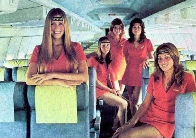 “My dad, probably 1970s. This is my favourite photo of him.”, “Pacific Southwest Airlines Stewardesses from the 70’s.”, “Economy class flying in 1970.”, “70’s Vintage Airline Stewardess.”, “Iran Air flight attendants in the 1970s.”, “First class on a United flight, 1970.”, An American Airlines advertisement from 1971., “Led Zeppelin (Early 1970s).”, “Chilling and smoking mid-air in the 70s.”, “Southwest Airlines Flight Attendant, Late 70s.”, “Elvis Presley &amp; Linda Thompson boarding a plane mid 70’s.”, “My flight attendant mom getting some oxygen for her hangover (70s).”, “Economy seating on Pan Am in the 70s.”, “These Vintage Photos of flight Stewardesses 70’s.”