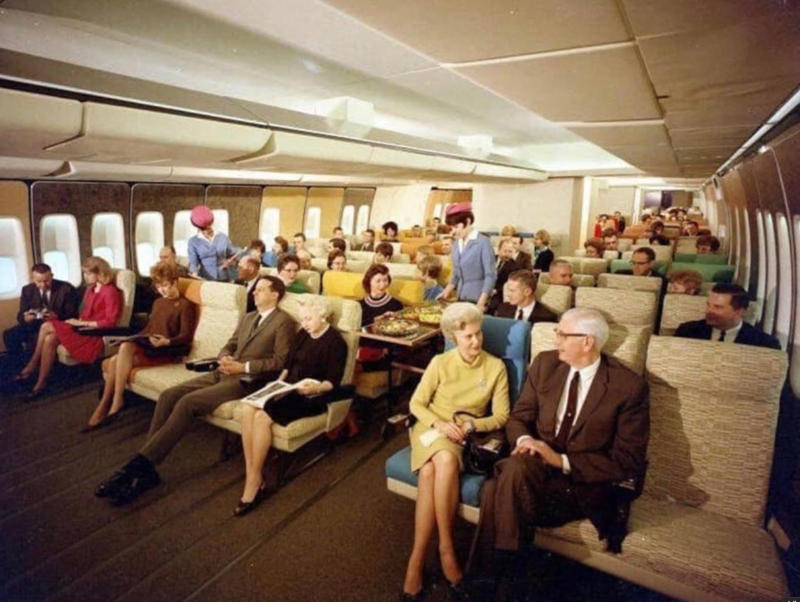 “Economy seating on Pan Am in the 70s.” “My dad, probably 1970s. This is my favourite photo of him.”, “Pacific Southwest Airlines Stewardesses from the 70’s.”, “Economy class flying in 1970.”, “70’s Vintage Airline Stewardess.”, “Iran Air flight attendants in the 1970s.”, “First class on a United flight, 1970.”, An American Airlines advertisement from 1971., “Led Zeppelin (Early 1970s).”, “Chilling and smoking mid-air in the 70s.”, “Southwest Airlines Flight Attendant, Late 70s.”, “Elvis Presley & Linda Thompson boarding a plane mid 70’s.”, “My flight attendant mom getting some oxygen for her hangover (70s).”, “Economy seating on Pan Am in the 70s.”, “These Vintage Photos of flight Stewardesses 70’s.”