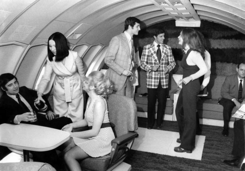 “Air Canada installed a dance floor in 1972 for their transatlantic flights in an effort to attract more passengers that wanted to dance and enjoy music at 30'000 feet.” “My dad, probably 1970s. This is my favourite photo of him.”, “Pacific Southwest Airlines Stewardesses from the 70’s.”, “Economy class flying in 1970.”, “70’s Vintage Airline Stewardess.”, “Iran Air flight attendants in the 1970s.”, “First class on a United flight, 1970.”, An American Airlines advertisement from 1971., “Led Zeppelin (Early 1970s).”, “Chilling and smoking mid-air in the 70s.”, “Southwest Airlines Flight Attendant, Late 70s.”, “Elvis Presley & Linda Thompson boarding a plane mid 70’s.”, “My flight attendant mom getting some oxygen for her hangover (70s).”, “Economy seating on Pan Am in the 70s.”, “These Vintage Photos of flight Stewardesses 70’s.”