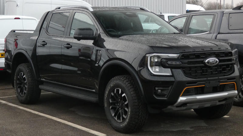 1. Ford Super Duty (F-250/F-350), 2. Tesla Cybertruck, 3. Ram HD With G56 Manual (2006–2018), 4. Lincoln Blackwood (2002 Only), 5. Ford 10R80-Equipped Trucks (F-150, Ranger), 6. 2013 Ram 1500, 7. Volkswagen Amarok (2nd‑Gen), 8. Toyota Hilux GR Sport, 9. 2025 Toyota Tacoma (Hybrid), 10. 2024 Chevrolet Colorado Z71, 1. Ford Maverick (2022–Present), 2. Hyundai Santa Cruz (2025), 3. Mazda BT‑50 (2025), 4. Ford Ranger (2025), 5. Ford F‑150 Lightning (EV), 6. Nissan Frontier (2025), 7. Chevrolet Silverado 1500, 8. GMC Sierra 1500, 9. Toyota Tundra (2nd Gen, 2007–Present), 10. Rivian R1T (EV)