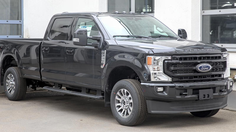 1. Ford Super Duty (F-250/F-350), 2. Tesla Cybertruck, 3. Ram HD With G56 Manual (2006–2018), 4. Lincoln Blackwood (2002 Only), 5. Ford 10R80-Equipped Trucks (F-150, Ranger), 6. 2013 Ram 1500, 7. Volkswagen Amarok (2nd‑Gen), 8. Toyota Hilux GR Sport, 9. 2025 Toyota Tacoma (Hybrid), 10. 2024 Chevrolet Colorado Z71, 1. Ford Maverick (2022–Present), 2. Hyundai Santa Cruz (2025), 3. Mazda BT‑50 (2025), 4. Ford Ranger (2025), 5. Ford F‑150 Lightning (EV), 6. Nissan Frontier (2025), 7. Chevrolet Silverado 1500, 8. GMC Sierra 1500, 9. Toyota Tundra (2nd Gen, 2007–Present), 10. Rivian R1T (EV)