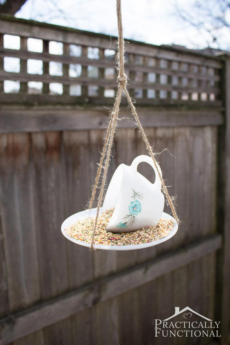 10) Tea Cup Bird Feeder 9) Soda Bottle Bird Feeder, 10) Tea Cup Bird Feeder, 11) Tea Cup Candle Sconce Bird Feeder, 12) Bird and Butterfly Water Feeder, 14) Acorn Bird Feeder, 15) Pine Cone Bird Feeders, 16) Glass Shade Bird Feeder