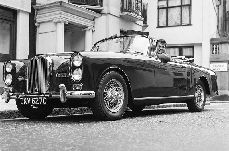 Tony Curtis - Alvis TE21 Famous people and nice cars have always had a close connection., The Rolling Stones - 1935 Bentley 3½ Litre, John Lennon - Rolls-Royce Phantom V, The Beatles - Triumph Herald, Steve McQueen - Ferrari 250 GT Lusso, Mick Jagger - Aston Martin DB6, Twiggy – Mercedes-Benz 250 SL, Keith Moon, James Brown & Muhammad Ali – 1966 Cadillac DeVille Convertible, Tony Curtis - Alvis TE21, The Who – Volvo P1800, Clint Eastwood – Austin-Healey 100M, Elvis Presley – Ford Thunderbird, Marvin Gaye – Rolls-Royce Phantom V, Led Zeppelin – Jaguar S-Type, Roger Moore – Volvo P1800, Roy Orbison – Rolls-Royce Phantom V, The Beatles – 1964 Ford Galaxie, John Lennon – Austin Maxi, Rod Stewart – Lamborghini Miura P400, Alice Cooper & Keith Moon - Rolls-Royces, Steve McQueen - Ferrari 275 GTS Convertible, Richard Burton – 1961 Rolls-Royce Silver Cloud II Drophead Coupé, Dean Martin – Jaguar E-Type, John Lennon – Radford Mini de Ville, Richard Burton & Elizabeth Taylor –Rolls-Royce Silver Wraith, Elvis Presley – BMW 507, Paul McCartney – Mini Cooper S De Ville, Johnny Hallyday – Triumph TR3, The Jackson Five & Diana Ross – Jaguar E-Type, John Lennon – Mercedes-Benz 600 Pullman, Michael Caine - Rolls-Royce Silver Shadow