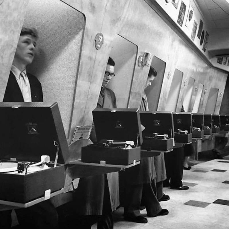 2. A London record store back in 1955 with customers hanging out in their lovely listening booths 1. A couple of the parents hanging around back in 1955, 2. A London record store back in 1955 with customers hanging out in their lovely listening booths, 3. A Debutant Ball back in 1955, 4. A couple of the grandparents hanging out in their home back in 1955 in Illinois, 5. Spain, circa 1955, 6. Girls from Germany in 1955, 7. Throwing it all the way back to July 2nd, 1955, 8. A lovely shot from school out in Sweden in 1955, 9. Manhattan, Times Square, 1955, 10. Hanging in the kitchen in New York, 1955, 11. The fish was delightful back in 1955, 12. Riding in the front with mom in 1955, 13. Drag racing in Los Angeles in 1955, 14. East Pender Street in Vancouver, BC, 1955, 15. A man bragging out in Spain in 1955, 16. East Harlem, New York City, circa 1955, 17. Harris and McKeever Market in Pittsburgh, circa 1955, 18. Commuters reading their newspapers on a train in Philadelphia, circa 1955, 19. A solid roller skating faceplant moment, 20. The scooter kids hanging out in Bonn, Germany, 1955, 21. All aboard for that sweet Saturday afternoon matinee, 22. Women and children hanging out at a pier in Hong Kong, circa 1955, 23. A busy mom out in New Rochelle, New York, 1955