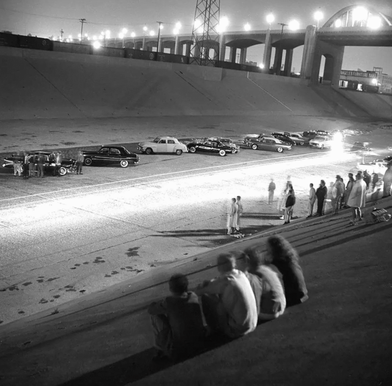 13. Drag racing in Los Angeles in 1955 1. A couple of the parents hanging around back in 1955, 2. A London record store back in 1955 with customers hanging out in their lovely listening booths, 3. A Debutant Ball back in 1955, 4. A couple of the grandparents hanging out in their home back in 1955 in Illinois, 5. Spain, circa 1955, 6. Girls from Germany in 1955, 7. Throwing it all the way back to July 2nd, 1955, 8. A lovely shot from school out in Sweden in 1955, 9. Manhattan, Times Square, 1955, 10. Hanging in the kitchen in New York, 1955, 11. The fish was delightful back in 1955, 12. Riding in the front with mom in 1955, 13. Drag racing in Los Angeles in 1955, 14. East Pender Street in Vancouver, BC, 1955, 15. A man bragging out in Spain in 1955, 16. East Harlem, New York City, circa 1955, 17. Harris and McKeever Market in Pittsburgh, circa 1955, 18. Commuters reading their newspapers on a train in Philadelphia, circa 1955, 19. A solid roller skating faceplant moment, 20. The scooter kids hanging out in Bonn, Germany, 1955, 21. All aboard for that sweet Saturday afternoon matinee, 22. Women and children hanging out at a pier in Hong Kong, circa 1955, 23. A busy mom out in New Rochelle, New York, 1955