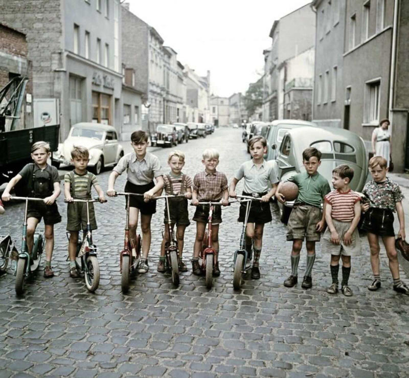 20. The scooter kids hanging out in Bonn, Germany, 1955 1. A couple of the parents hanging around back in 1955, 2. A London record store back in 1955 with customers hanging out in their lovely listening booths, 3. A Debutant Ball back in 1955, 4. A couple of the grandparents hanging out in their home back in 1955 in Illinois, 5. Spain, circa 1955, 6. Girls from Germany in 1955, 7. Throwing it all the way back to July 2nd, 1955, 8. A lovely shot from school out in Sweden in 1955, 9. Manhattan, Times Square, 1955, 10. Hanging in the kitchen in New York, 1955, 11. The fish was delightful back in 1955, 12. Riding in the front with mom in 1955, 13. Drag racing in Los Angeles in 1955, 14. East Pender Street in Vancouver, BC, 1955, 15. A man bragging out in Spain in 1955, 16. East Harlem, New York City, circa 1955, 17. Harris and McKeever Market in Pittsburgh, circa 1955, 18. Commuters reading their newspapers on a train in Philadelphia, circa 1955, 19. A solid roller skating faceplant moment, 20. The scooter kids hanging out in Bonn, Germany, 1955, 21. All aboard for that sweet Saturday afternoon matinee, 22. Women and children hanging out at a pier in Hong Kong, circa 1955, 23. A busy mom out in New Rochelle, New York, 1955