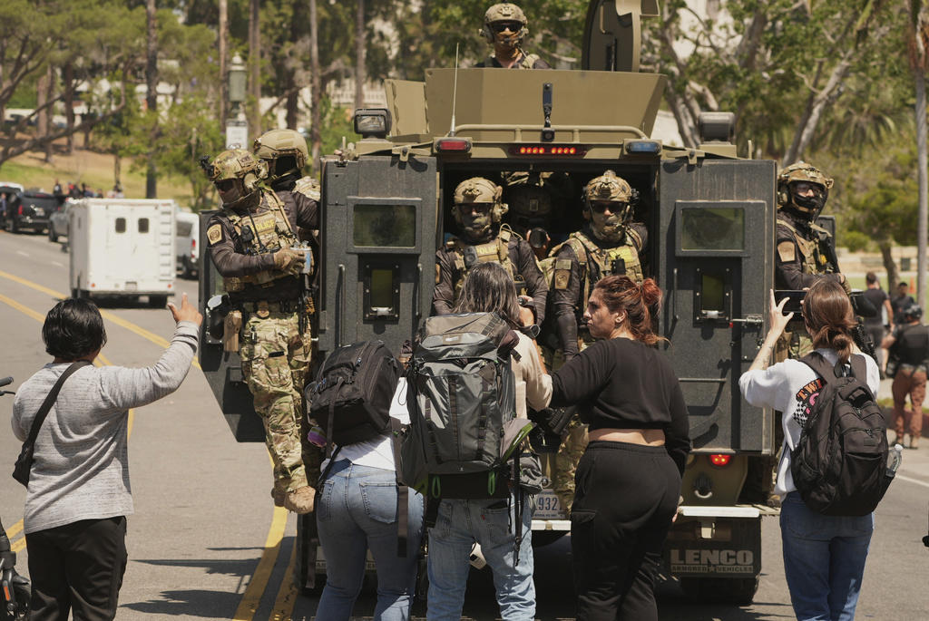 What happened and was anyone arrested?, What's the history of MacArthur Park?, What did the Guard do?, Why were military troops in Los Angeles?, How did the community react?