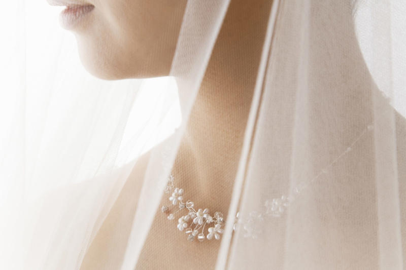The bridal veil Some wedding traditions aren’t as 'innocent' as you think, The bridal veil, Exchanging rings, Carrying the bride over the threshold, The wedding cake, The bride’s garter, Stepping on a glass, Bride kidnapping