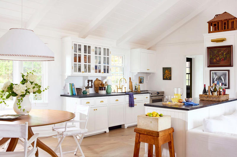 A Light-Filled Welcome, Slipcovered Seating in the Living Room, A Crisp, White Kitchen, A Light & Bright Dining Room, A High Contrast Powder Room, Natural Materials, Off-the-Shelf Meets Antiques, Estate Sale Scores, A Multi-Purpose Screened-In Porch, Dreamy Poolside Living, An Outdoor Shower