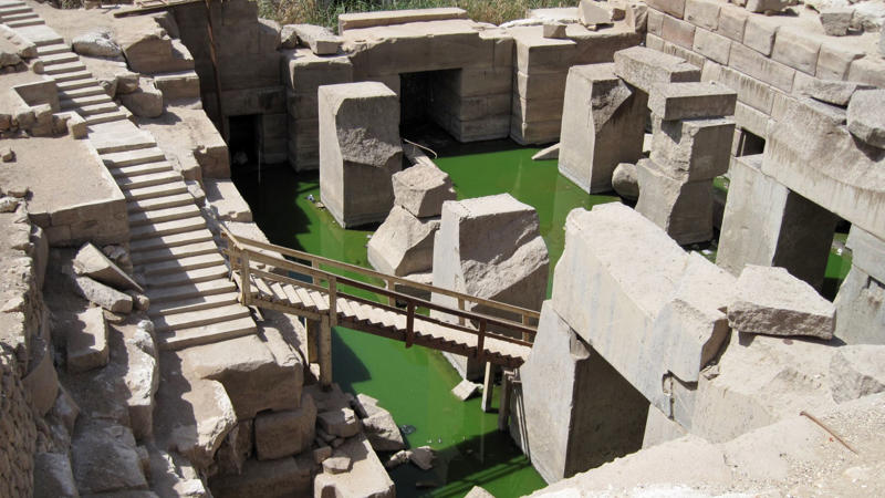 1. The Great Pyramid Of Giza, Egypt, 2. Stonehenge, England, 3. Puma Punku, Bolivia, 4. Sacsayhuamán, Peru, 5. Gobekli Tepe, Turkey, 6. Baalbek's Trilithon Stones, Lebanon, 7. Bada Valley Megaliths, Indonesia, 8. The Longyou Caves, China, 9. Nan Madol, Micronesia, 10. The Kailasa Temple, India, 11. The Hypogeum of Ħal Saflieni, Malta, 12. Teotihuacan's Pyramids, Mexico, 13. Derinkuyu Underground City, Turkey, 14. The Osirion At Abydos, Egypt, 15. The Yonaguni Monument, Japan, 16. The Plain Of Jars, Laos, 17. Newgrange, Ireland, 18. The Unfinished Obelisk, Egypt, 19. The Treasury At Petra, Jordan, 20. Mohenjo-Daro, Pakistan