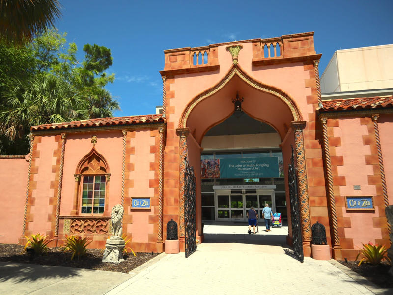 The Ringlings' legacy continues to dazzle visitors. Colored glass windows bring Sarasota's Gulf Coast into the mansion., The ballroom and its ornate ceiling are standout features of the property., The ballroom ceiling is comprised of 22 custom canvases., The formal dining room features design inspirations from all over the Mediterranean., Often, guests arrived by sea., Visitors to Ca' d'Zan can also enjoy the Ringlings' circus museum., The Ringlings' legacy continues to dazzle visitors.