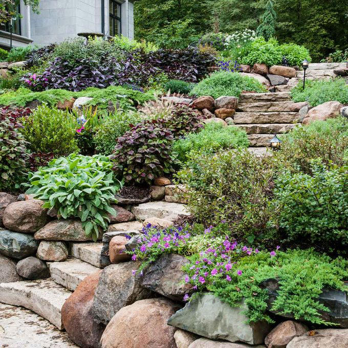 Terraced Hillside Landscaping, Steps with Retaining Wall, Create a Rock Garden, Hillside Water Feature, Front Yard Retaining Wall, Patio Overlook, Hillside Landscaping with Mulch, Tiered Raised Beds, Front Deck for a Sloped Yard, Prairie Garden Hillside Landscaping