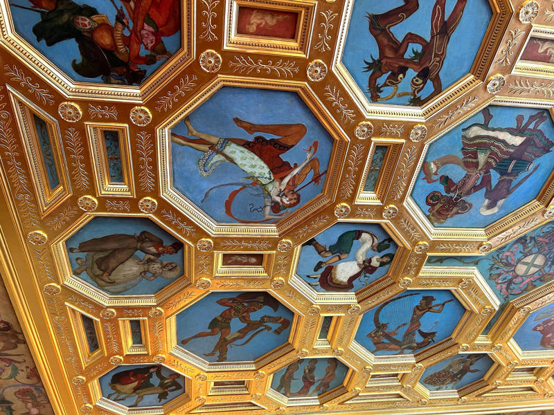 The ballroom ceiling is comprised of 22 custom canvases. Colored glass windows bring Sarasota's Gulf Coast into the mansion., The ballroom and its ornate ceiling are standout features of the property., The ballroom ceiling is comprised of 22 custom canvases., The formal dining room features design inspirations from all over the Mediterranean., Often, guests arrived by sea., Visitors to Ca' d'Zan can also enjoy the Ringlings' circus museum., The Ringlings' legacy continues to dazzle visitors.