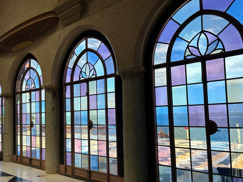 Colored glass windows bring Sarasota's Gulf Coast into the mansion. Colored glass windows bring Sarasota's Gulf Coast into the mansion., The ballroom and its ornate ceiling are standout features of the property., The ballroom ceiling is comprised of 22 custom canvases., The formal dining room features design inspirations from all over the Mediterranean., Often, guests arrived by sea., Visitors to Ca' d'Zan can also enjoy the Ringlings' circus museum., The Ringlings' legacy continues to dazzle visitors.