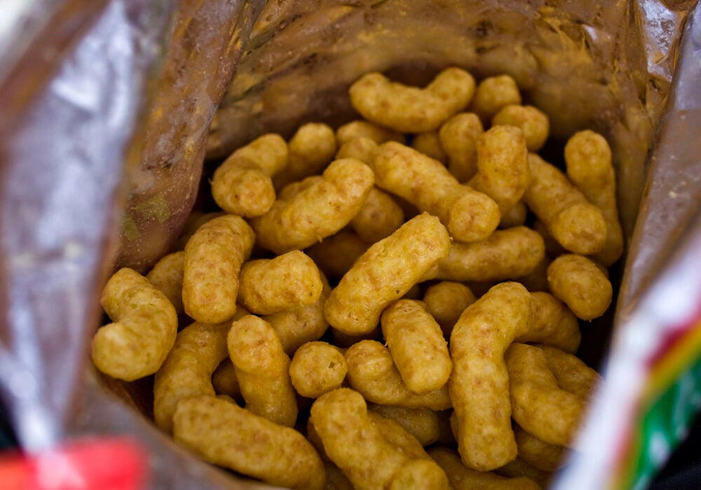 1. Dunkaroos were the gold standard of lunchbox clout., 2. Hi-C Ecto Cooler meant your fridge was practically glowing., 3. Pizzarias chips were basically pizza in a bag., 4. Planters Cheez Balls turned orange fingers into a badge of honor., 5. Oreo O’s made cereal feel like dessert before school., 6. Squeezit drinks turned hydration into a color war., 7. Fruit String Thing was edible art on a plastic tray., 8. PB Crisps made peanuts feel like treasure., 9. Magic Middles were cookies with a buttery secret., 10. Reggie! Bars made baseball edible and indulgent.