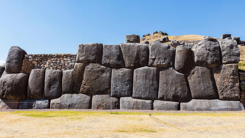 1. The Great Pyramid Of Giza, Egypt, 2. Stonehenge, England, 3. Puma Punku, Bolivia, 4. Sacsayhuamán, Peru, 5. Gobekli Tepe, Turkey, 6. Baalbek's Trilithon Stones, Lebanon, 7. Bada Valley Megaliths, Indonesia, 8. The Longyou Caves, China, 9. Nan Madol, Micronesia, 10. The Kailasa Temple, India, 11. The Hypogeum of Ħal Saflieni, Malta, 12. Teotihuacan's Pyramids, Mexico, 13. Derinkuyu Underground City, Turkey, 14. The Osirion At Abydos, Egypt, 15. The Yonaguni Monument, Japan, 16. The Plain Of Jars, Laos, 17. Newgrange, Ireland, 18. The Unfinished Obelisk, Egypt, 19. The Treasury At Petra, Jordan, 20. Mohenjo-Daro, Pakistan