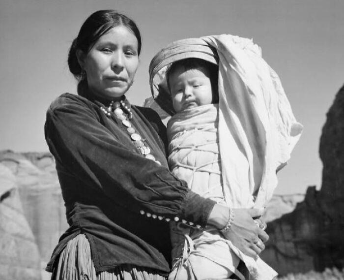 Strength and Heritage in Canyon De Chelly Royal Dining with Angela Lansbury and Basil Rathbone, Breaking Barriers: Mary Wallace’s Historic Drive, Strength and Heritage in Canyon De Chelly, Portrait of Youth: Kiowa Girl, Berber Beauty: Ouled Nail Girl, A Shared Moment: Paula and Her Kitten, Marilyn Monroe’s Playful Potato Sack Look, Challenging the Rules: Brooklyn Dress Code Protest, 1940, Wolof Family Portrait by Emile Noal, Reunion After a Long Voyage, Elegance in Motion: Manon Chaufour by Martin Imboden, Dad’s Got Moves: Melbourne, 1940s, Fire Escape Embrace, 1946, Ani Chokyi of Tibet, Captured in Darjeeling, 1890s, Headlines and Daydreams, Champs Elysées, 1947, Timeless Athens: The Acropolis in 1860, Catharina ‘Toto’ Koopman: A Parisian Muse, 1933, On the Road Together: Family Hitchhiking, California, Einstein and His Beloved Violin, 1941, Edmund Kesting’s Play with Light and Shadow, 1930, Champagne Inspector in Protective Mask, Helen Bennett’s Stunning Spider Dress, 1939, Harriet Hoctor’s Graceful Question Mark, 1925, Double the Dazzle: The Dolly Sisters in the 1920s, Glamour at The Forbidden City, 1948, Double the Glamour: Mother-Daughter Style, 1954, Cardboard Couture: Sicilian Suit Substitute, The Day Daddy Came Home: Hector Murdoch’s Return, Courage Behind Bars: Mexico, 1935, Milk Time Mischief at Arch Badertscher’s Farm