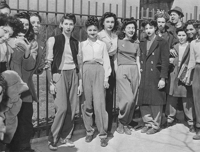 Challenging the Rules: Brooklyn Dress Code Protest, 1940 Royal Dining with Angela Lansbury and Basil Rathbone, Breaking Barriers: Mary Wallace’s Historic Drive, Strength and Heritage in Canyon De Chelly, Portrait of Youth: Kiowa Girl, Berber Beauty: Ouled Nail Girl, A Shared Moment: Paula and Her Kitten, Marilyn Monroe’s Playful Potato Sack Look, Challenging the Rules: Brooklyn Dress Code Protest, 1940, Wolof Family Portrait by Emile Noal, Reunion After a Long Voyage, Elegance in Motion: Manon Chaufour by Martin Imboden, Dad’s Got Moves: Melbourne, 1940s, Fire Escape Embrace, 1946, Ani Chokyi of Tibet, Captured in Darjeeling, 1890s, Headlines and Daydreams, Champs Elysées, 1947, Timeless Athens: The Acropolis in 1860, Catharina ‘Toto’ Koopman: A Parisian Muse, 1933, On the Road Together: Family Hitchhiking, California, Einstein and His Beloved Violin, 1941, Edmund Kesting’s Play with Light and Shadow, 1930, Champagne Inspector in Protective Mask, Helen Bennett’s Stunning Spider Dress, 1939, Harriet Hoctor’s Graceful Question Mark, 1925, Double the Dazzle: The Dolly Sisters in the 1920s, Glamour at The Forbidden City, 1948, Double the Glamour: Mother-Daughter Style, 1954, Cardboard Couture: Sicilian Suit Substitute, The Day Daddy Came Home: Hector Murdoch’s Return, Courage Behind Bars: Mexico, 1935, Milk Time Mischief at Arch Badertscher’s Farm
