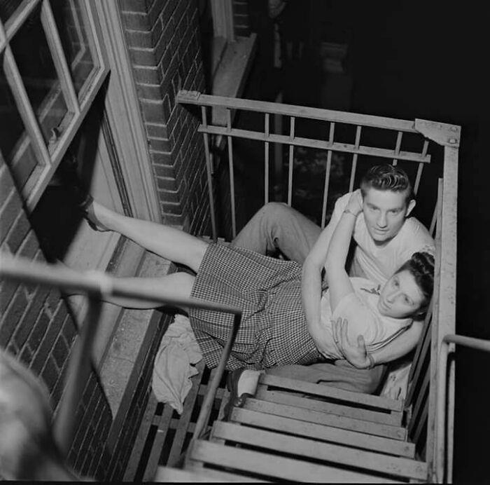 Fire Escape Embrace, 1946 Royal Dining with Angela Lansbury and Basil Rathbone, Breaking Barriers: Mary Wallace’s Historic Drive, Strength and Heritage in Canyon De Chelly, Portrait of Youth: Kiowa Girl, Berber Beauty: Ouled Nail Girl, A Shared Moment: Paula and Her Kitten, Marilyn Monroe’s Playful Potato Sack Look, Challenging the Rules: Brooklyn Dress Code Protest, 1940, Wolof Family Portrait by Emile Noal, Reunion After a Long Voyage, Elegance in Motion: Manon Chaufour by Martin Imboden, Dad’s Got Moves: Melbourne, 1940s, Fire Escape Embrace, 1946, Ani Chokyi of Tibet, Captured in Darjeeling, 1890s, Headlines and Daydreams, Champs Elysées, 1947, Timeless Athens: The Acropolis in 1860, Catharina ‘Toto’ Koopman: A Parisian Muse, 1933, On the Road Together: Family Hitchhiking, California, Einstein and His Beloved Violin, 1941, Edmund Kesting’s Play with Light and Shadow, 1930, Champagne Inspector in Protective Mask, Helen Bennett’s Stunning Spider Dress, 1939, Harriet Hoctor’s Graceful Question Mark, 1925, Double the Dazzle: The Dolly Sisters in the 1920s, Glamour at The Forbidden City, 1948, Double the Glamour: Mother-Daughter Style, 1954, Cardboard Couture: Sicilian Suit Substitute, The Day Daddy Came Home: Hector Murdoch’s Return, Courage Behind Bars: Mexico, 1935, Milk Time Mischief at Arch Badertscher’s Farm