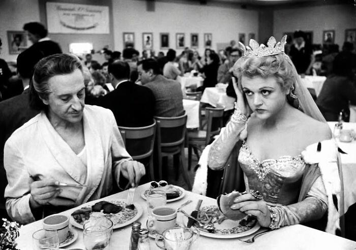 Royal Dining with Angela Lansbury and Basil Rathbone Royal Dining with Angela Lansbury and Basil Rathbone, Breaking Barriers: Mary Wallace’s Historic Drive, Strength and Heritage in Canyon De Chelly, Portrait of Youth: Kiowa Girl, Berber Beauty: Ouled Nail Girl, A Shared Moment: Paula and Her Kitten, Marilyn Monroe’s Playful Potato Sack Look, Challenging the Rules: Brooklyn Dress Code Protest, 1940, Wolof Family Portrait by Emile Noal, Reunion After a Long Voyage, Elegance in Motion: Manon Chaufour by Martin Imboden, Dad’s Got Moves: Melbourne, 1940s, Fire Escape Embrace, 1946, Ani Chokyi of Tibet, Captured in Darjeeling, 1890s, Headlines and Daydreams, Champs Elysées, 1947, Timeless Athens: The Acropolis in 1860, Catharina ‘Toto’ Koopman: A Parisian Muse, 1933, On the Road Together: Family Hitchhiking, California, Einstein and His Beloved Violin, 1941, Edmund Kesting’s Play with Light and Shadow, 1930, Champagne Inspector in Protective Mask, Helen Bennett’s Stunning Spider Dress, 1939, Harriet Hoctor’s Graceful Question Mark, 1925, Double the Dazzle: The Dolly Sisters in the 1920s, Glamour at The Forbidden City, 1948, Double the Glamour: Mother-Daughter Style, 1954, Cardboard Couture: Sicilian Suit Substitute, The Day Daddy Came Home: Hector Murdoch’s Return, Courage Behind Bars: Mexico, 1935, Milk Time Mischief at Arch Badertscher’s Farm